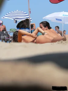2 topless thonged sexy friends on the beach with great bodies