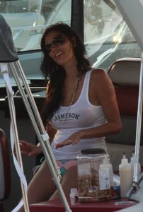 Bikini babe on a boat with a wet see through white shirt showing her tits