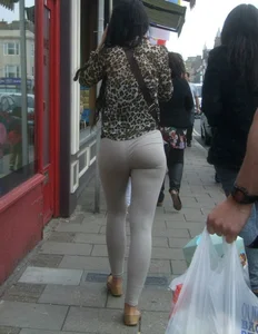 Brunette lady with a nice ass in light grey leggings walking