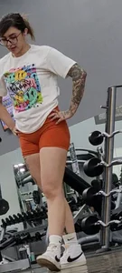 Tattooed PAWG showing cakes in tight shorts