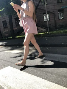 Cute candid girl in pink shorts street photos