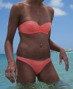 Skinny girl in peach bikini with cameltoe