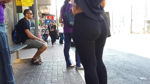 Sexy ass in leggings waiting for the bus