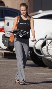 Sexy girl in the parking lot in tight grey sweatpants