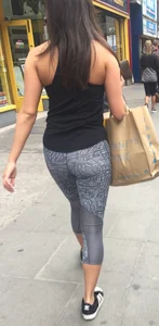 Sexy girl walking in grey patterned leggings with friend in tight jeans