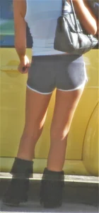 Skinny babe going to her car in little cotton shorts