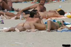 Beach voyeur girls in bikinis, thongs and topless