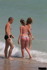 Beach voyeur girls in bikinis, thongs and topless
