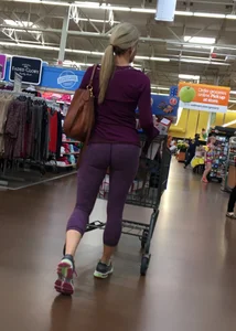 Sexy blonde shopping at Walmart in purple leggings with some vpl