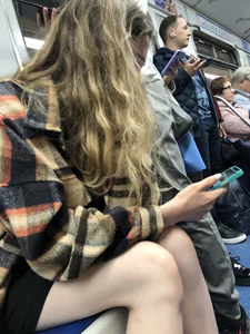 Very cute candid girl with very pale skin sitting in a subway train creepshots