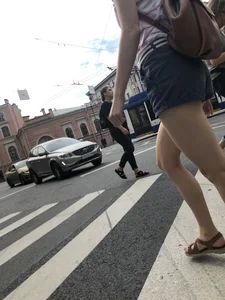 Young Girl in Shorts And Sandals Crossing the Street Gallery