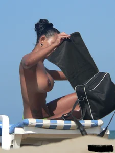 Hot ass topless beach girl with great tits lets her little brother oil up her ass in thong bikini