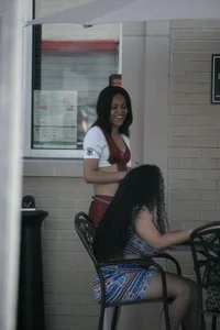 Two sexy Tilted Kilt employees showing cleavage and cheeks