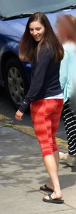 Beautiful brunette teen in orange patterned leggings