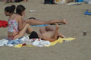 Topless girls on a beach in Barcelona