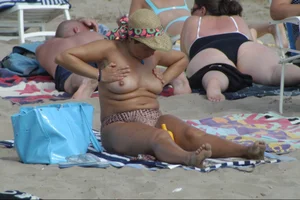 Girls on a nude beach in Sitges, Spain