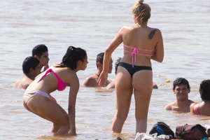 Candid beach girls in thongs
