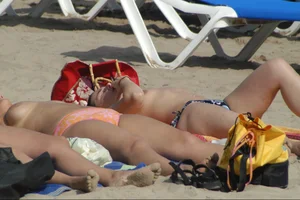 Girls on a nude beach in Sitges, Spain
