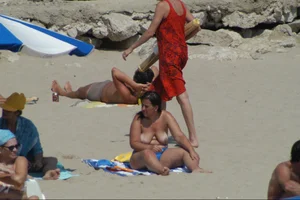 Girls on a nude beach in Sitges, Spain