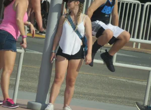 Couple of babes standing around in shorts