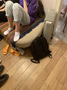 Young Girl in Pants And White Socks Sitting on the Couch Home Creepshot