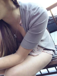 A Sexy Skinny Girl Sitting on a Street Bench, Candid Downblouse Photo