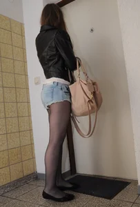 Young Girl in Shorts and Black Pantyhose with Hot Muscular Legs