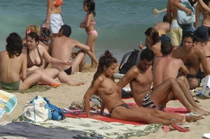 Topless girls on a beach in Barcelona