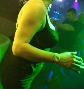 Busty milf in the disco. Big tits, big nipples