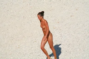 Ula FKK Sexy brunette on a nude beach topless, bottomless and with blue thong