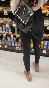 Cute butt in shiny black leggings