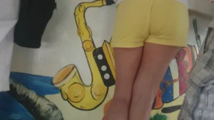 Milf in yellow shorts with vpl and a wedgie