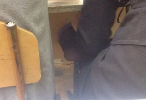Candid teen shoe dangle in class