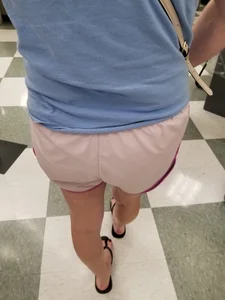 Nice blonde ass in athletic shorts while shopping