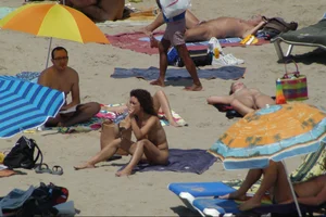 Girls on a nude beach in Sitges, Spain