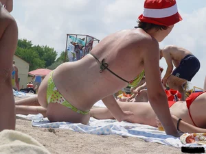 Beach voyeur girls in bikinis, thongs and topless