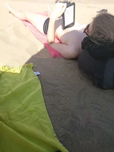 Topless teen girlfriend on the beach with nice tits