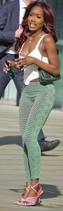 Slim ebony teens in leggings posing in the sun