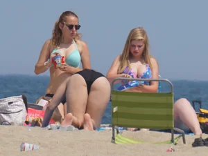 3 girls on the beach in bikinis with big boobs, one brunette and two blondes
