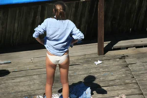 Two teens stripping and going topless to tan