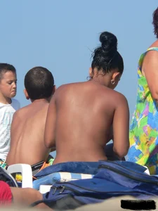 Hot ass topless beach girl with great tits lets her little brother oil up her ass in thong bikini