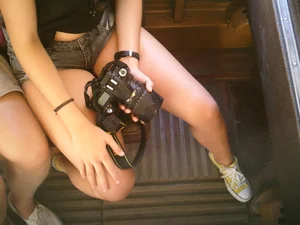 Sexy girl on the bus in jean shorts with nice legs and cleavage