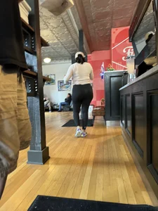 Big ass girl In tights at cafe