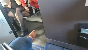 Cute stewardess in skirt, pantyhose and heels