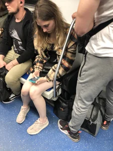 Very cute candid girl with very pale skin sitting in a subway train creepshots