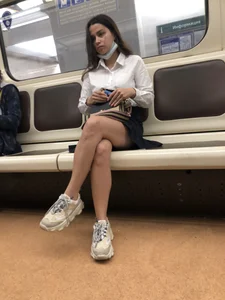 Girl in a Blouse And a Skirt With Great Legs Creepshots Gallery - Standing on the Subway Station, then Sitting With Crossed Legs in a Train