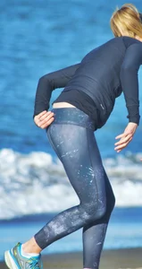 Beach redhead milf in patterened leggings at the beach