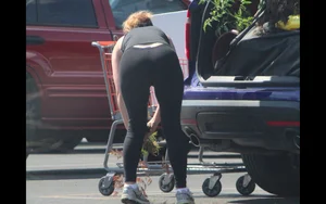 Redhead milf with a nice ass and vtl in leggings while loading her car