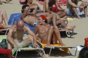 Topless girls on a beach in Barcelona