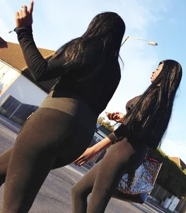 2 sexy black girls in leggings with nice asses